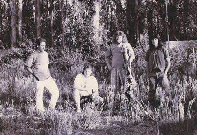 Photo of YYME band against background of trees